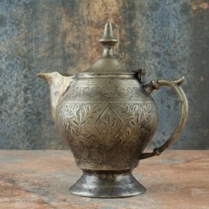 Vintage Antique Ancient Kettle on Marble Background