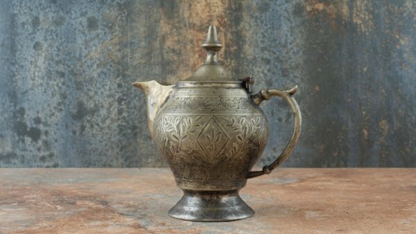 Vintage Antique Ancient Kettle on Marble Background