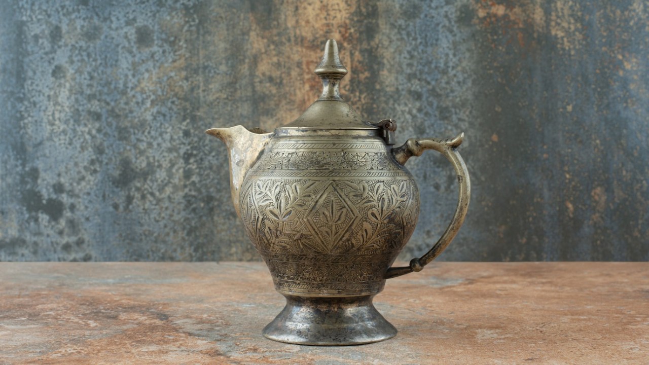 Vintage Antique Ancient Kettle on Marble Background